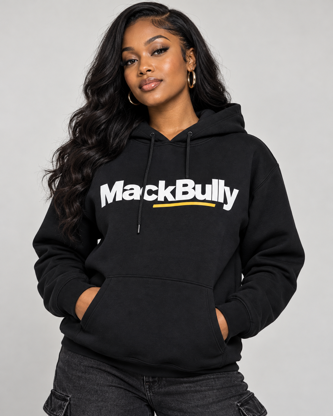 Female model wearing the black MackBully hooded sweatshirt